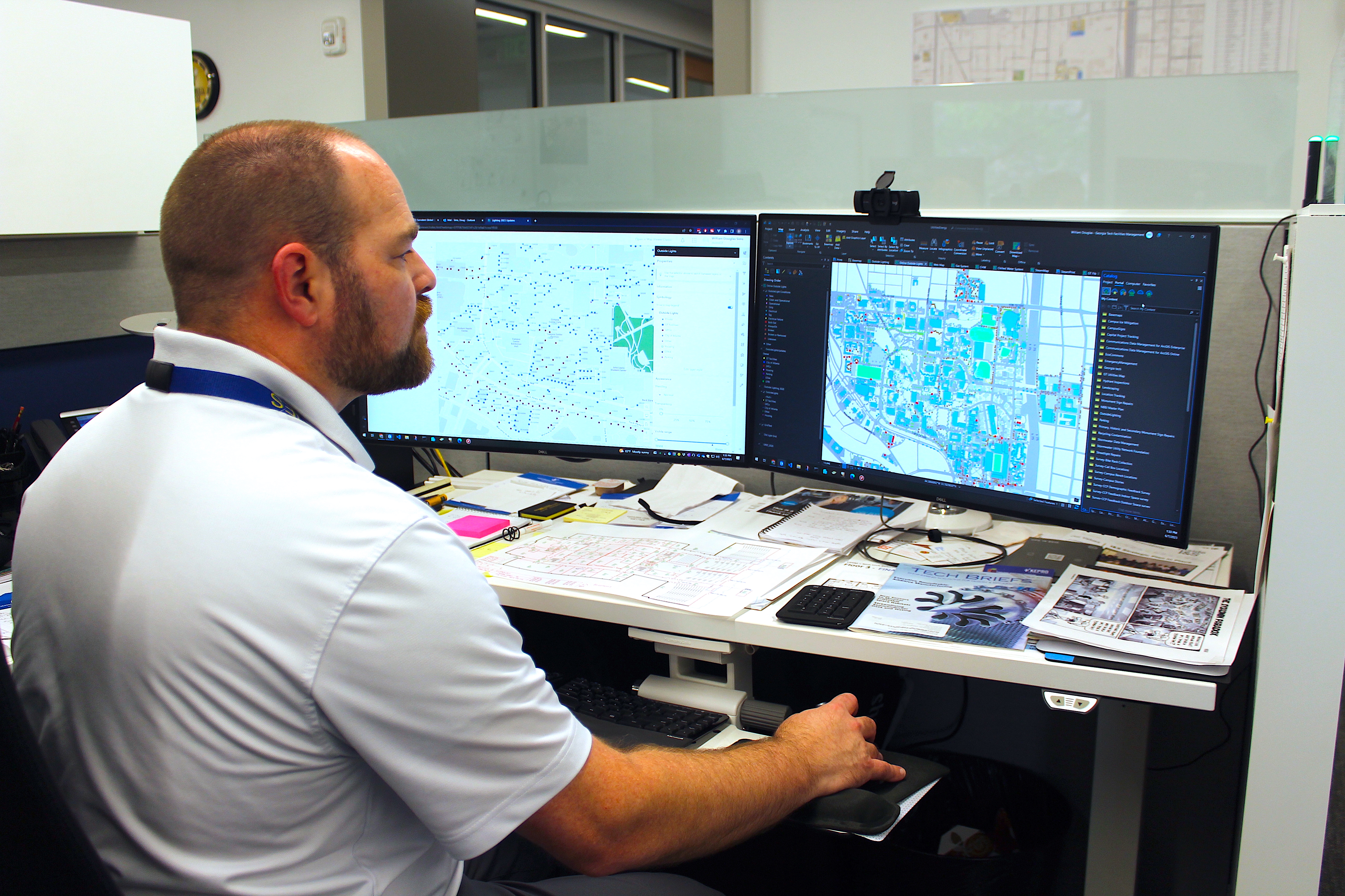 Senior Systems Support Engineer for Infrastructure and Sustainability Doug Sims reviews a GIS data set. 
