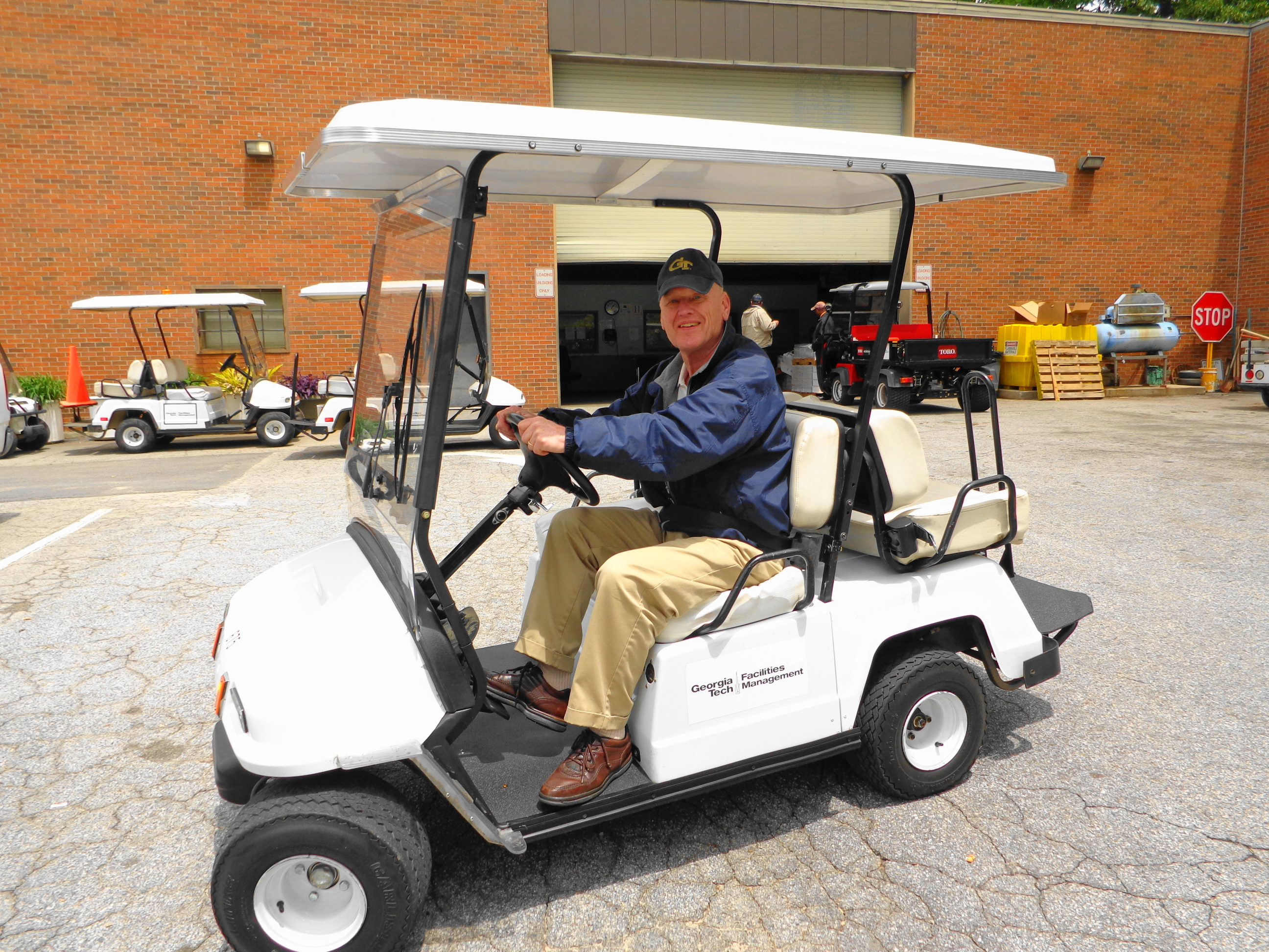 Warren Page in the golf cart that he was known for driving around campus. (Image courtesy of Bill Halabi)