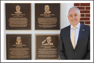 President Cabrera with four veteran plaques