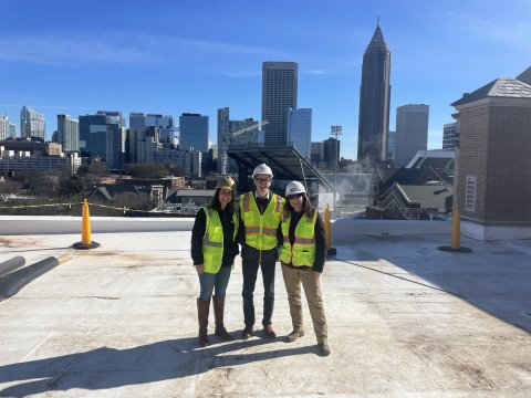 Infrastructure and Sustainability construction team members on the roof of the D.M. Smith building.